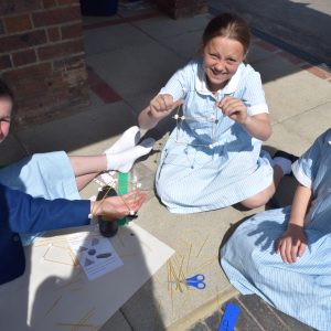 students making stick creations