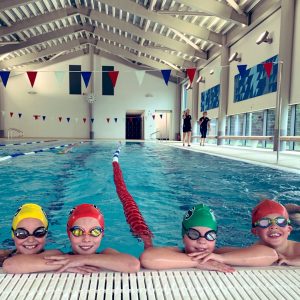 group of students at side of swimming pool