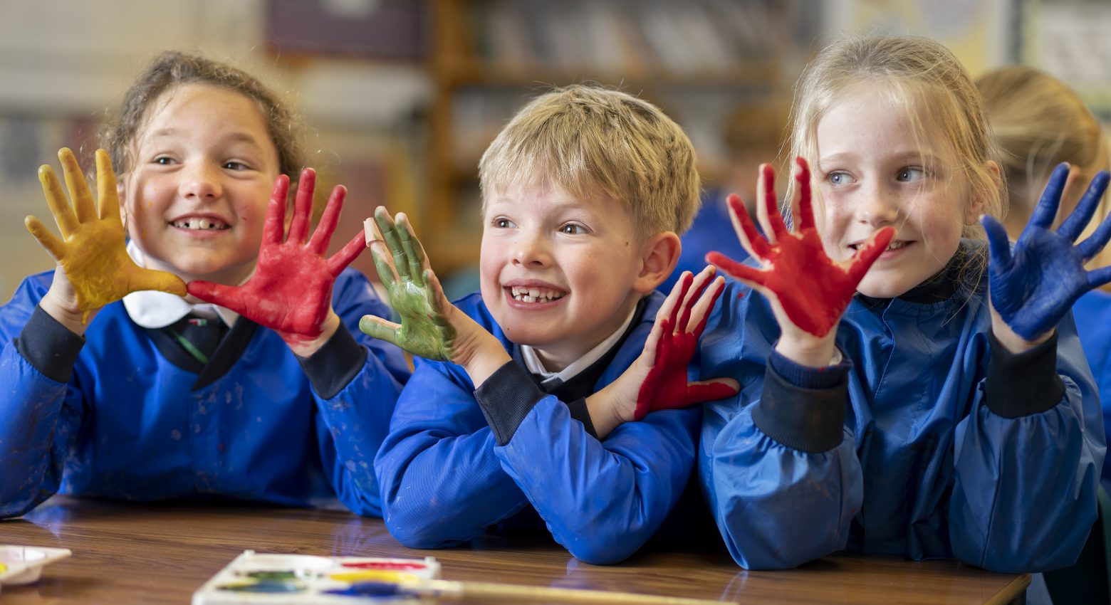 children with paint on their hands