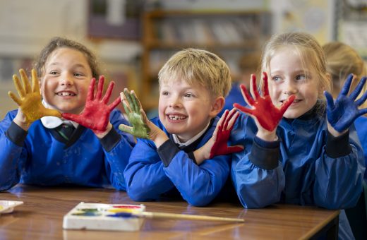 children with paint on their hands