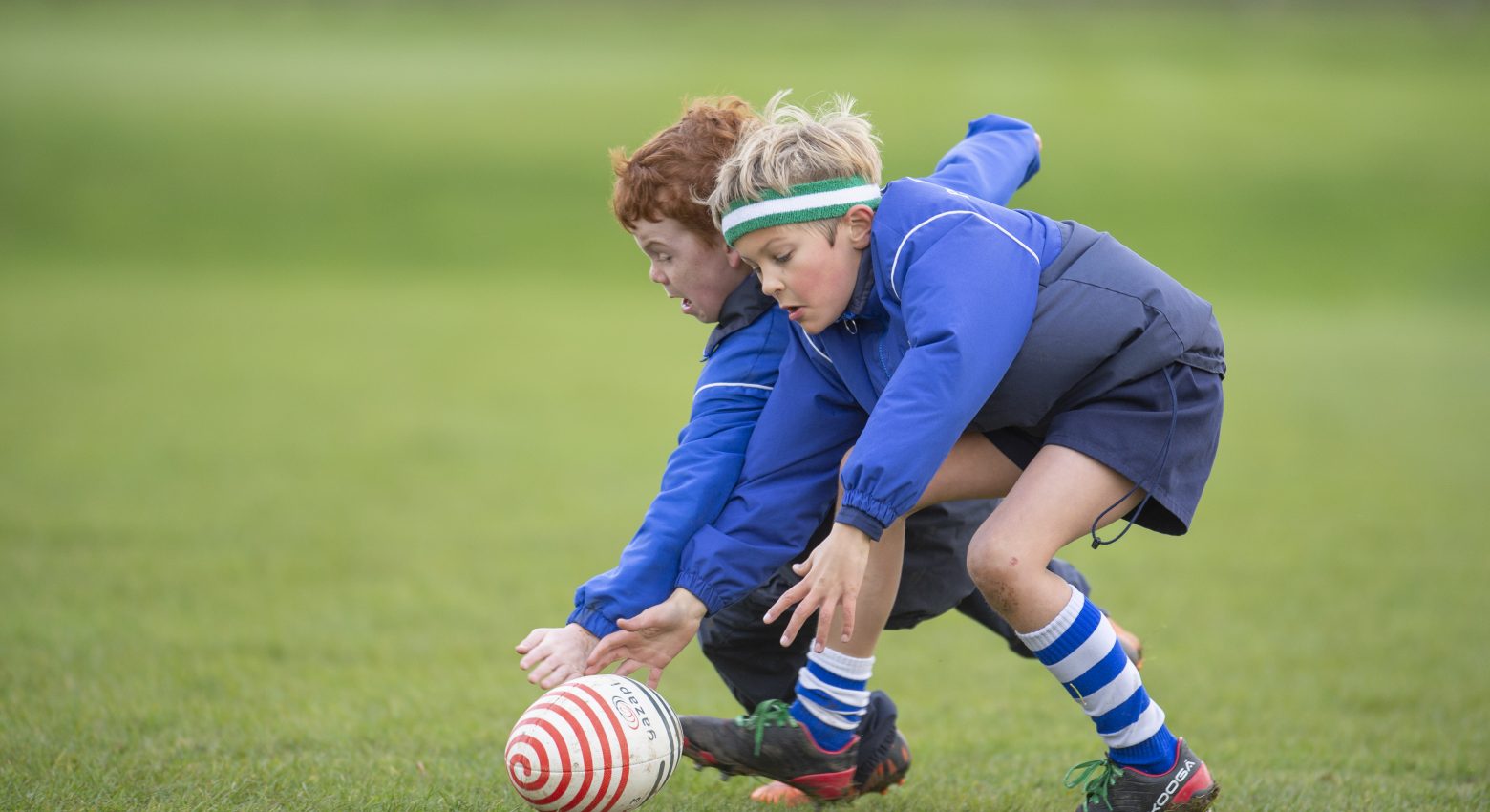 Boys playing rugby