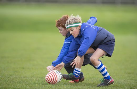 Boys playing rugby